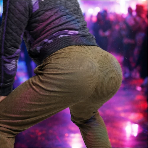 Danny Wave in a purple and black hoodie and tan trousers, posing for Twerkathon Round 2.