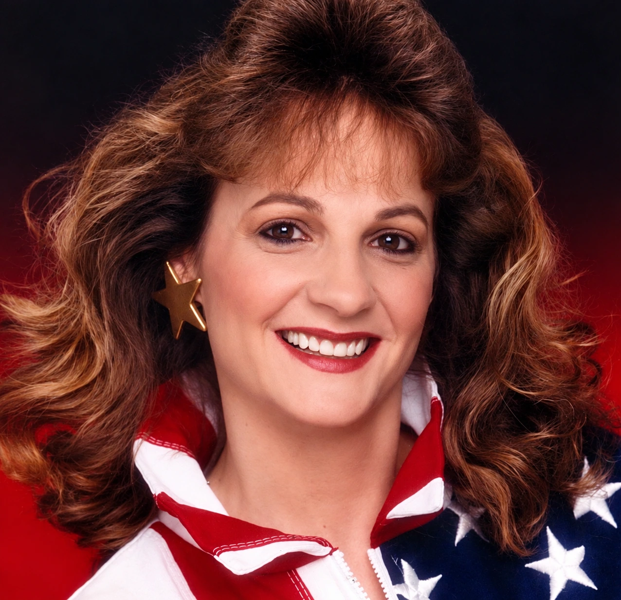 Danny’s mom in her early-1990s glamour shot, with big hair, gold star earrings, and a stars-and-stripes jacket.